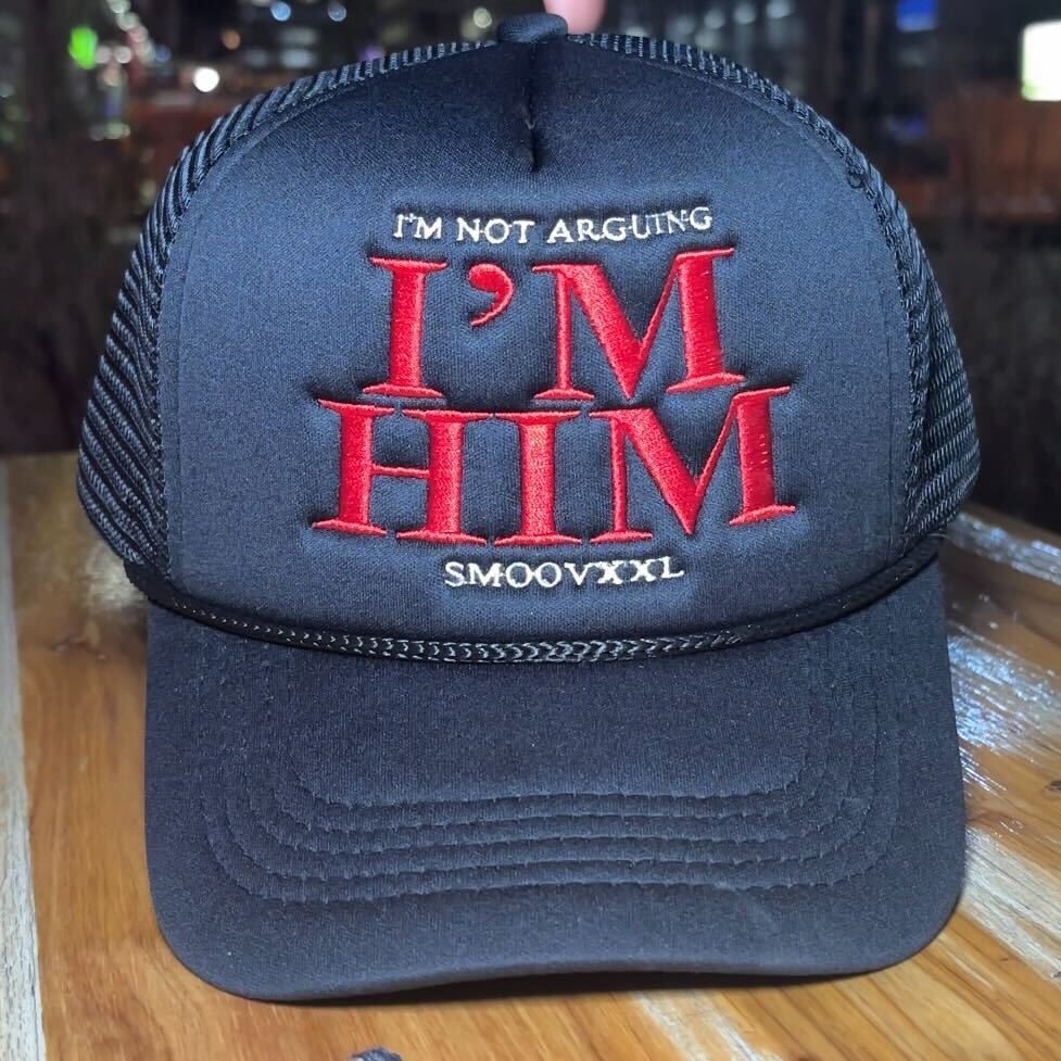 I’M NOT ARGUING- I’M HIM Trucker Hat (Black)