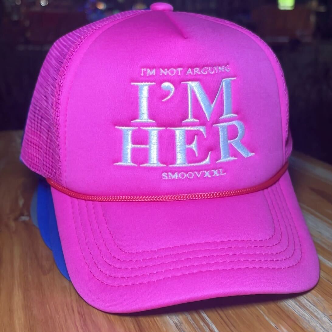 I’M NOT ARGUING- I’M HER Trucker Hat (Pink)